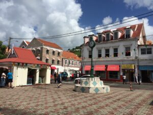 a street with buildings and a clock