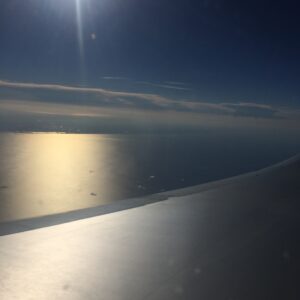 a view of the ocean from an airplane window