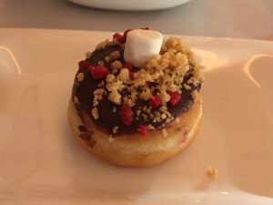 a donut with a marshmallow and crumble on top