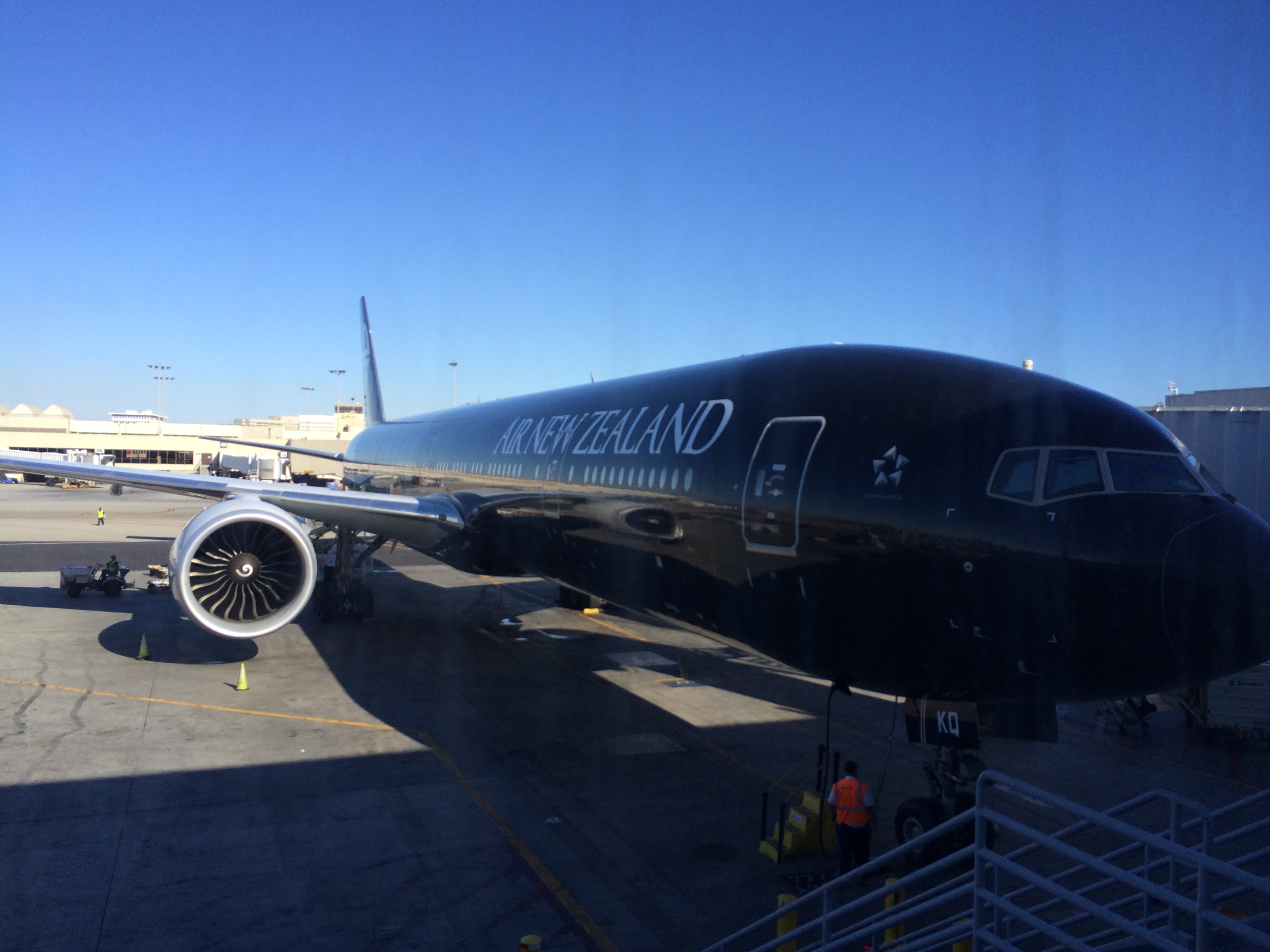 a large black airplane at an airport