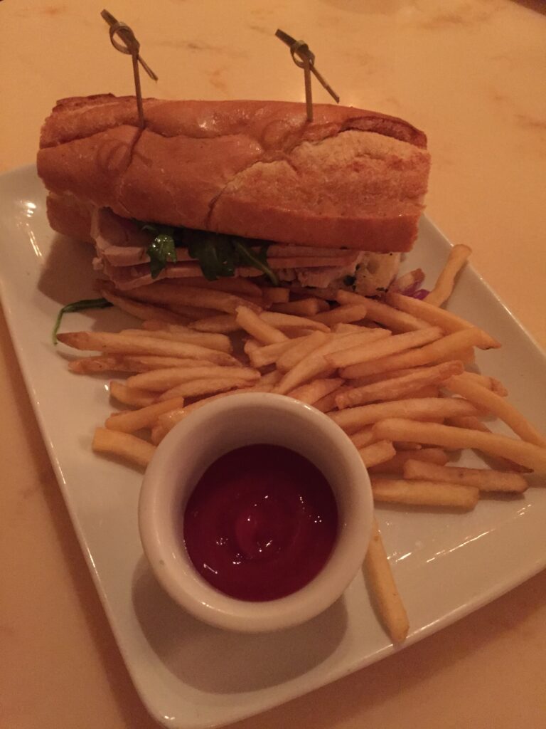 a sandwich and french fries on a plate