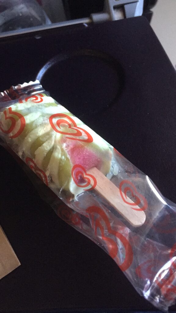 a fruit popsicle in a plastic wrapper