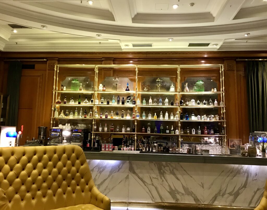 a bar with shelves of liquor and bottles